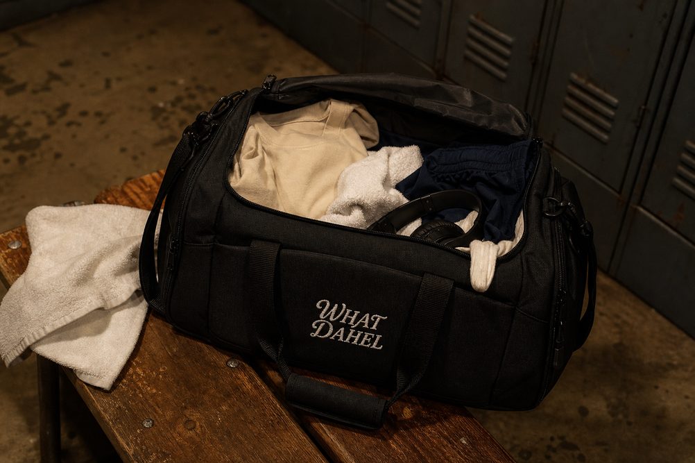 A packed bag on the locker room bench