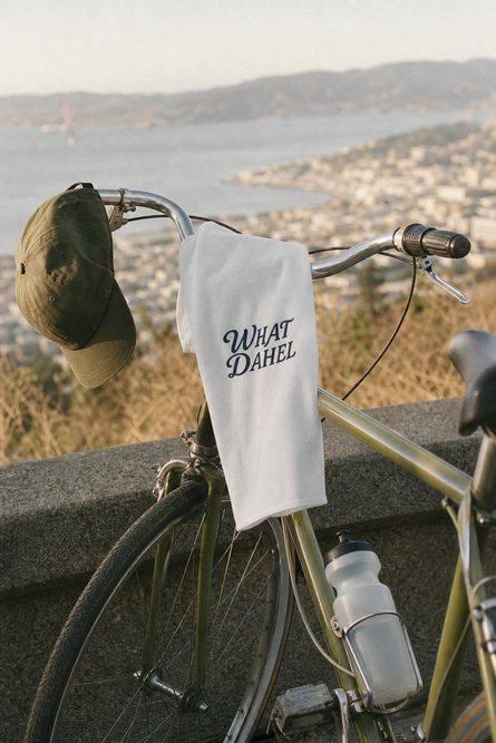 The What Dahel towel and a hat on a bike, overlooking the bay